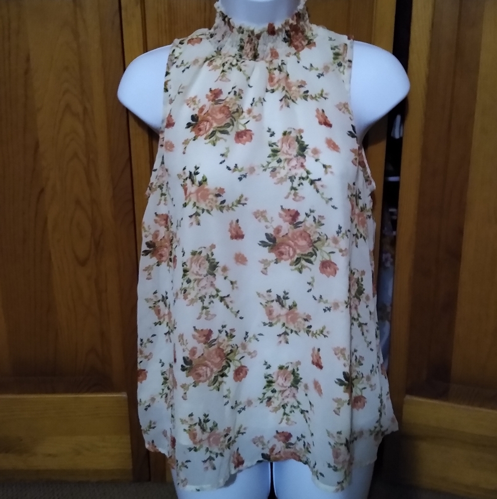 Med sleeveless floral blouse  with high collar